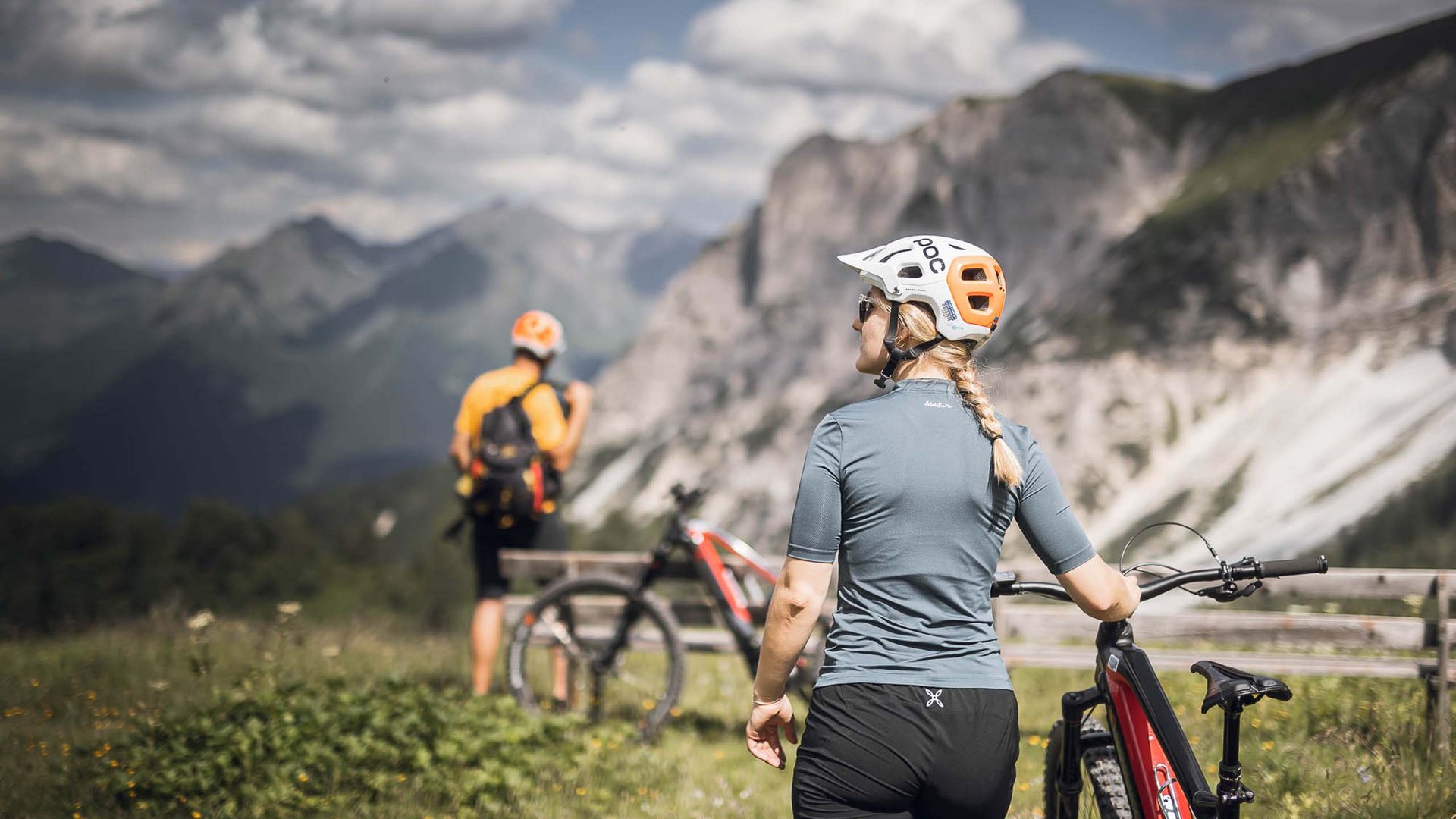 Pflerschtal: accommodation for biking holidays Two cyclists wearing helmets in the mountains on a sunny day